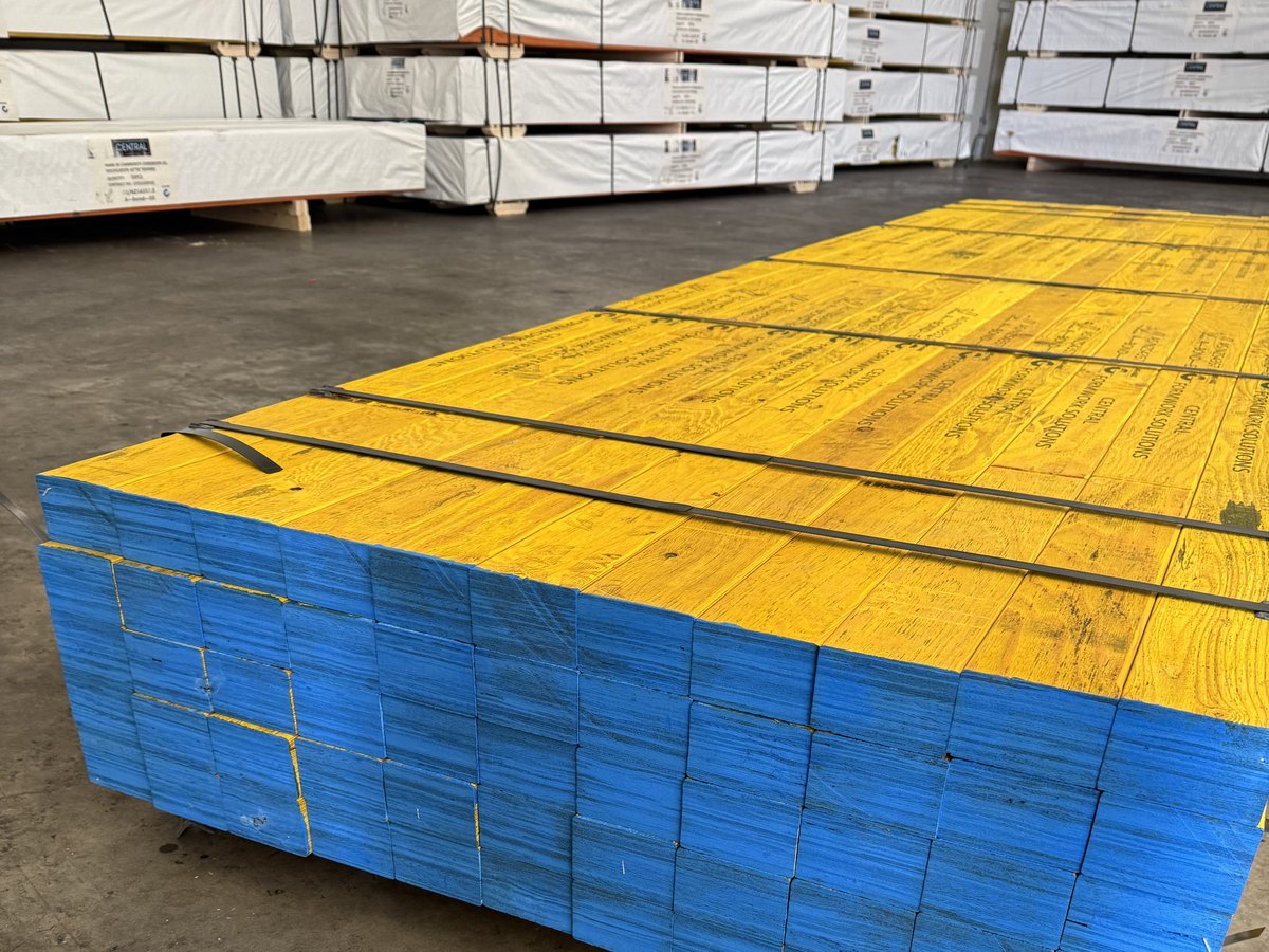 Central Form LVL pack in the warehouse — yellow faces, blue ends