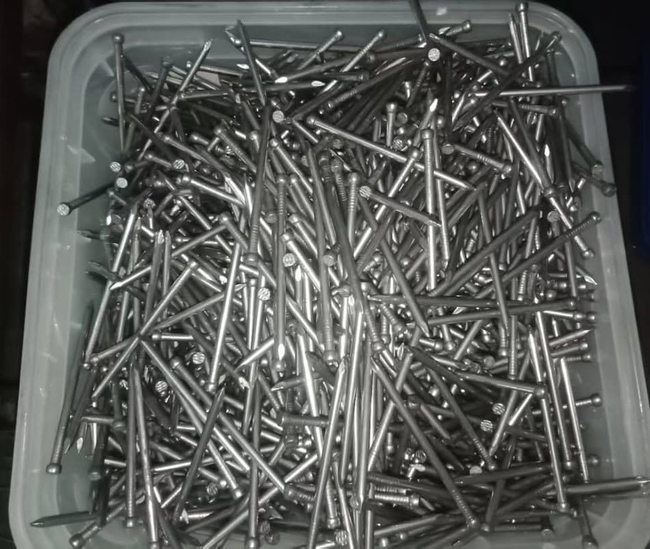 Open tub of Central bright bullet head nails
